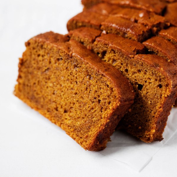 Freshly sliced pieces of classic vegan pumpkin bread.